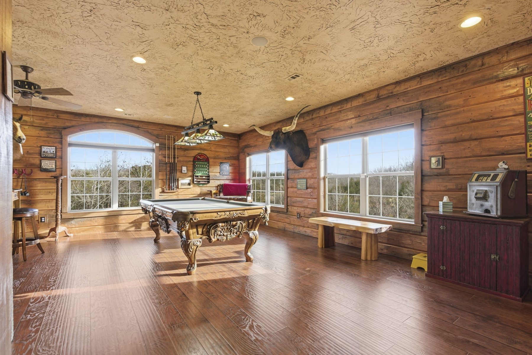 Game room with pool table and arched window