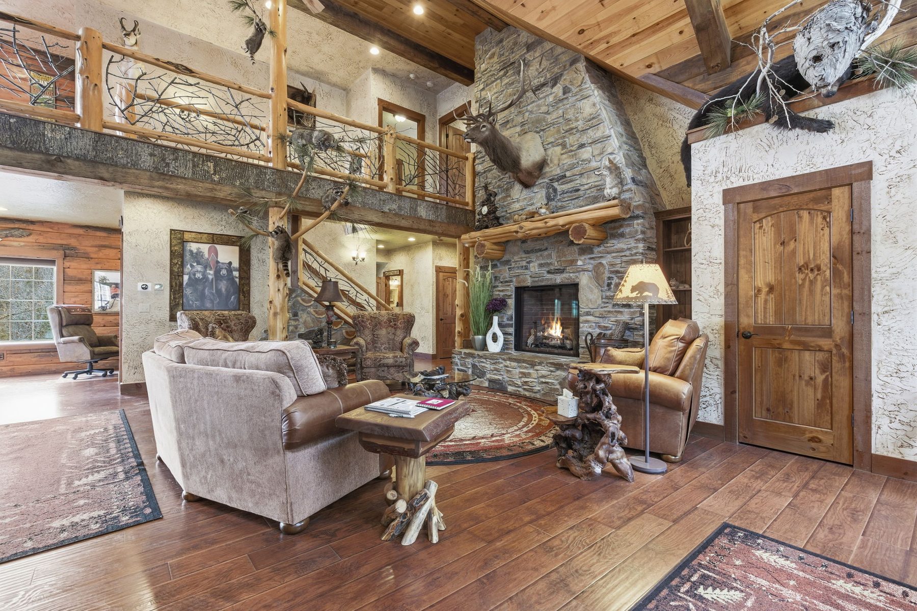Great room with stone fireplace and seating